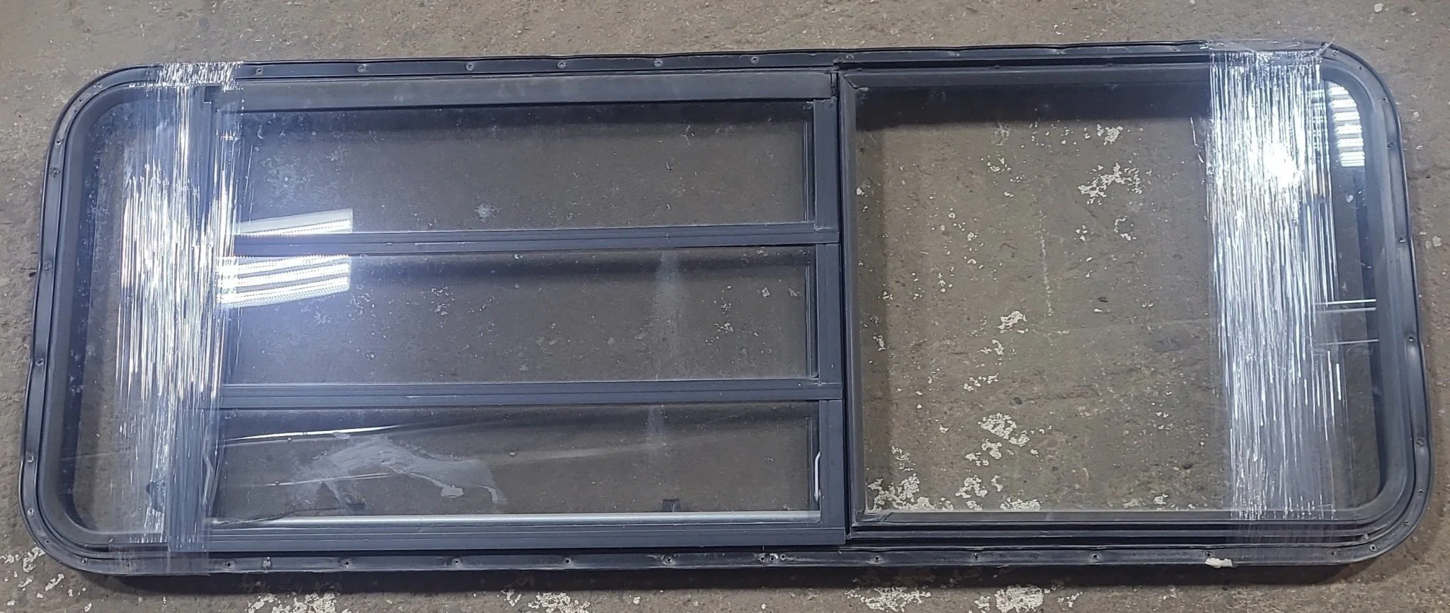 Used Black Radius Emergency Opening Window : 21 3/4" W x 59 3/4" H x 1 1/4" D