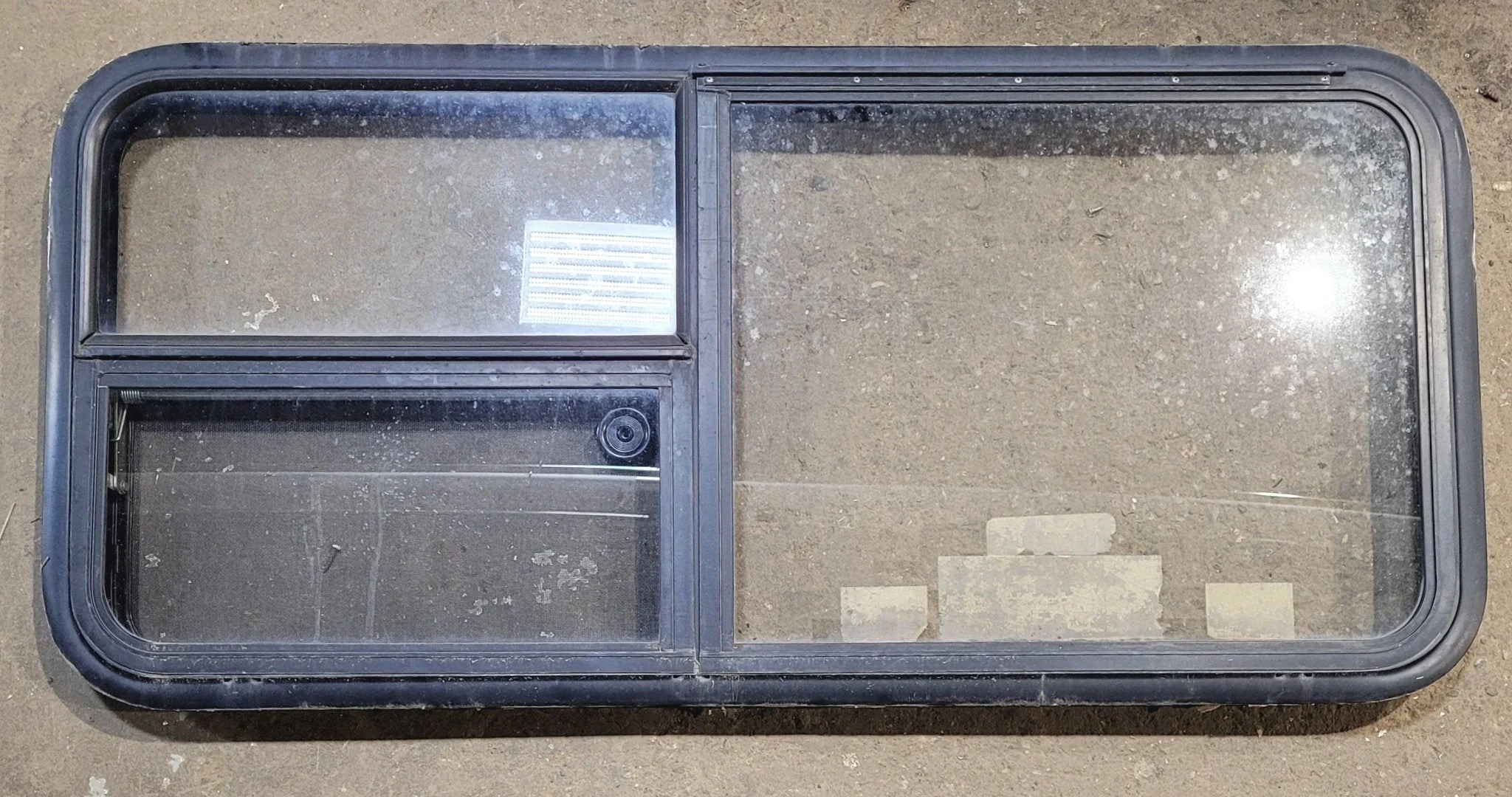 Used Black Radius Emergency Opening Window : 47 1/4" W x 21 1/4" H x 1 7/8"