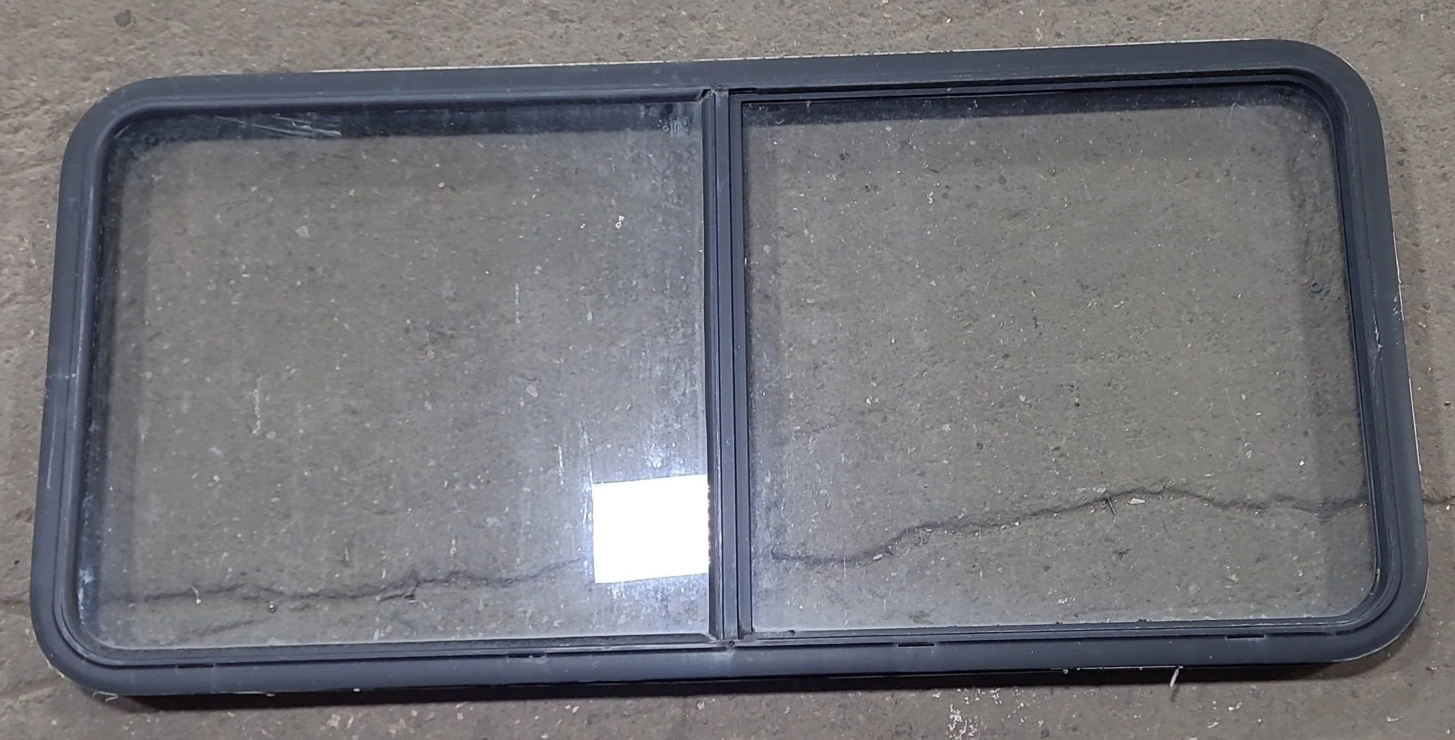 Used Black Radius Emergency Opening Window : 55 1/2" W x 25 1/2" H x 1 7/8" D