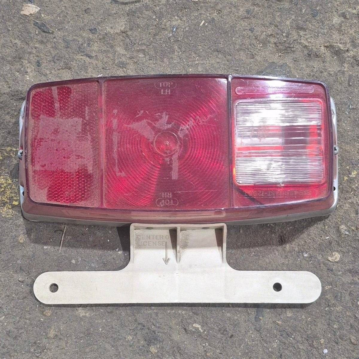 Used Miro-Flex RV Tail Light Assembly, With License Plate Bracket, 10 1/8" X 7" X 2 3/4" - 340