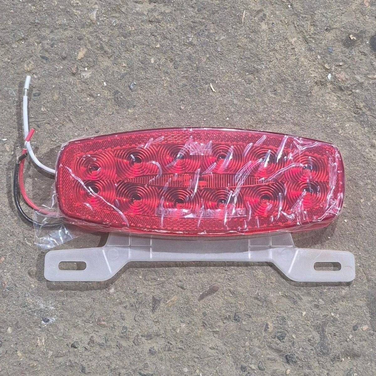 Used RV Tail Light Assembly, With License Plate Bracket, 8.625" x 4.125" x 1.25"- DOT SAE A2I6S2T2L 18