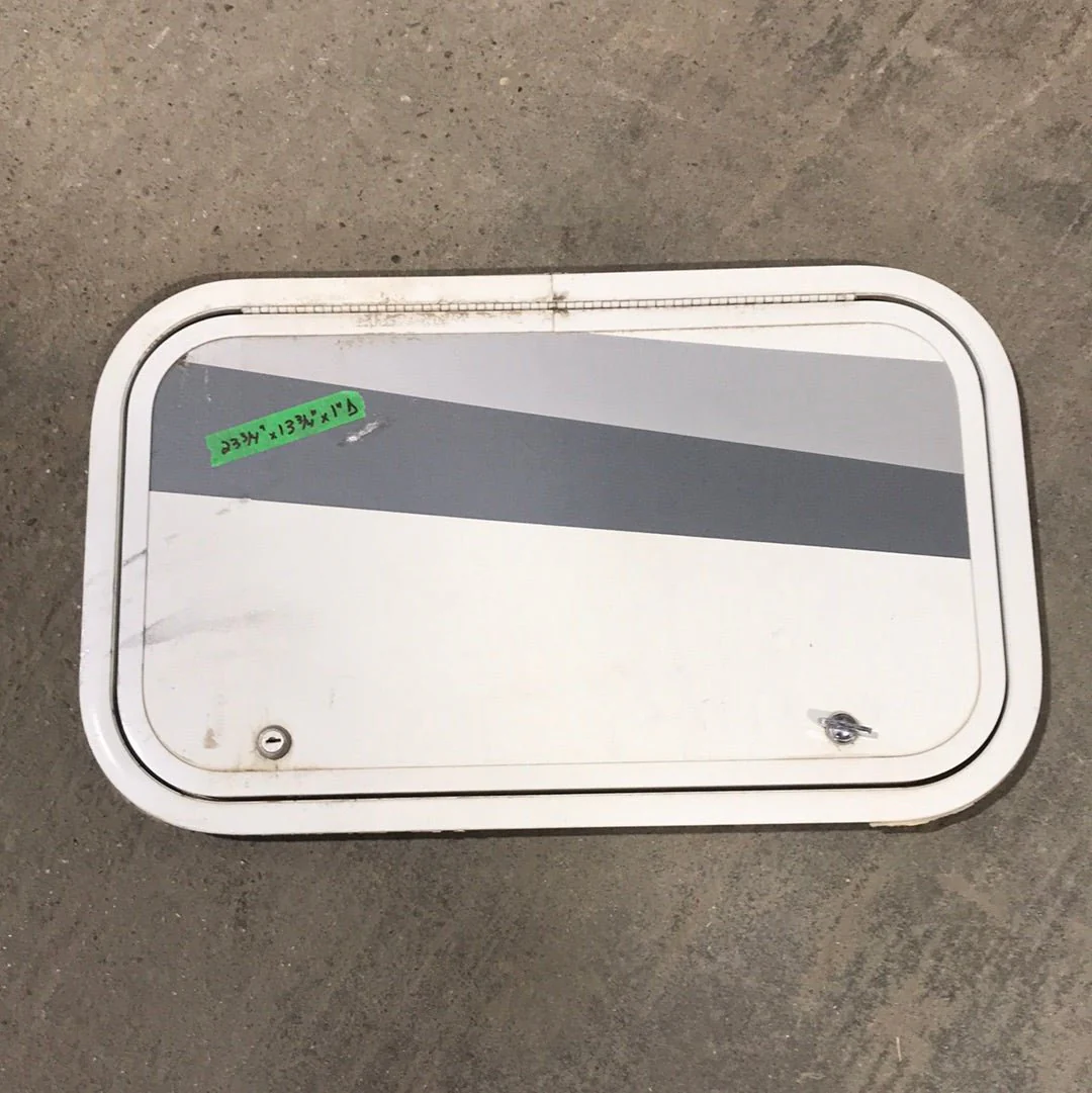 Used White Corner radius cargo door 23 3/4" W x 13 3/4" H x 1"D